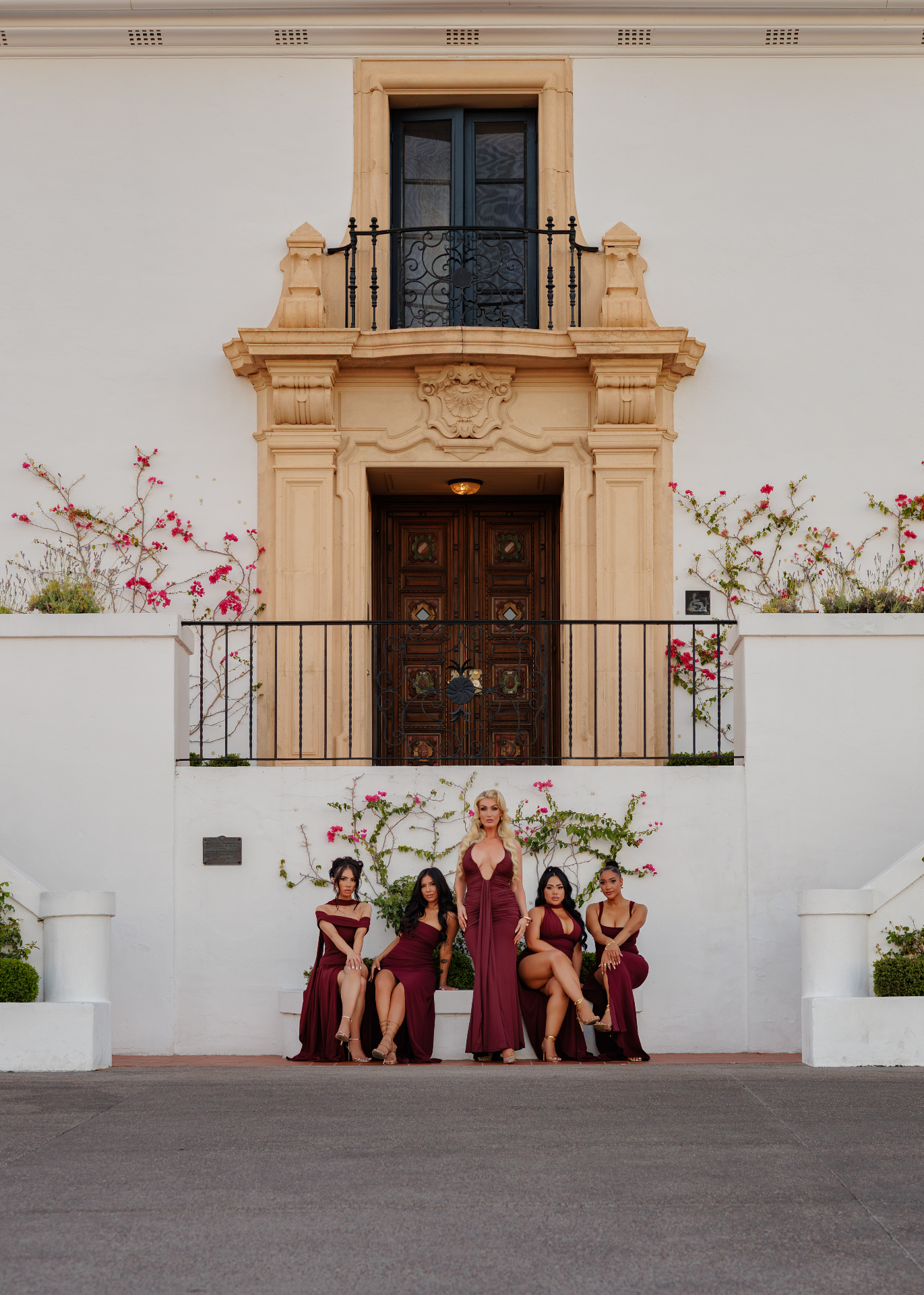 Five women posed outside the studio